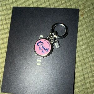New auth coach bottle cap charm
